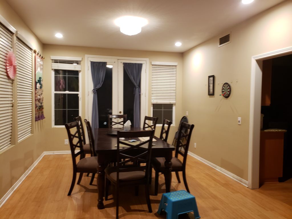 A dining room whose furniture and walls don't quite match.